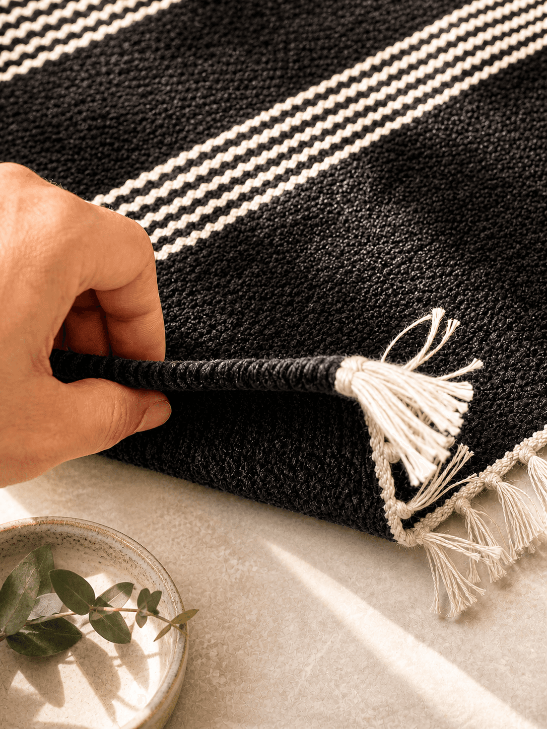 Traditional Shotoronji handwoven floor mat with geometric patterns in red, black and cream — made in Bangladesh view 3